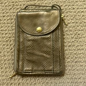 A bronze colored small crossbody bag/clutch.